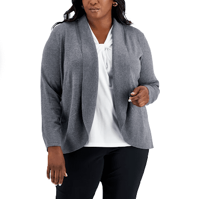 plus-sized model wears a gray sweater jacket with a shawl collar, a white blouse and black work pants